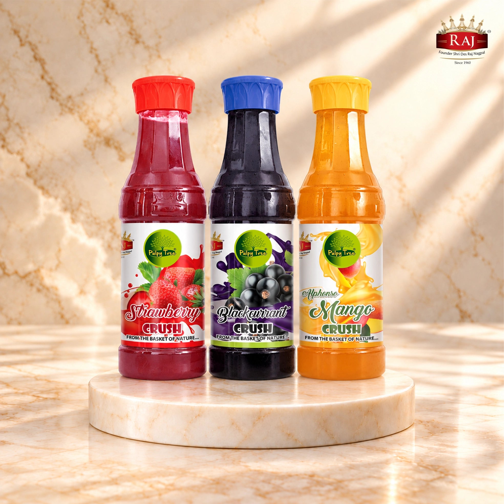 RAJ Pulpy Tree Fruit Crush Combo featuring Strawberry, Blackcurrant and Alphonso Mango bottles.