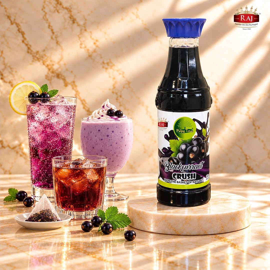 RAJ Pulpy Tree Blackcurrant Crush bottle beside a blackcurrant mocktail, milkshake and iced tea.