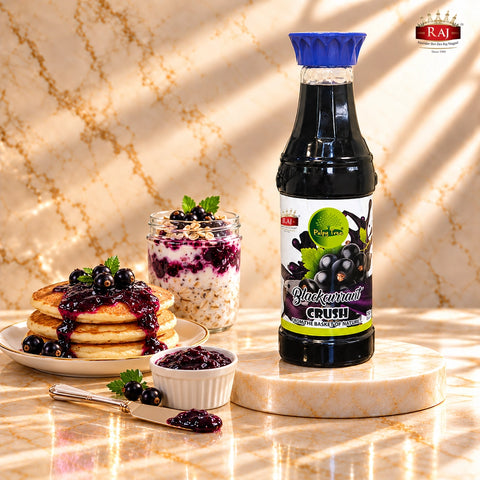 RAJ Pulpy Tree Blackcurrant Crush bottle with blackcurrant-topped pancakes, overnight oats and berry spread.