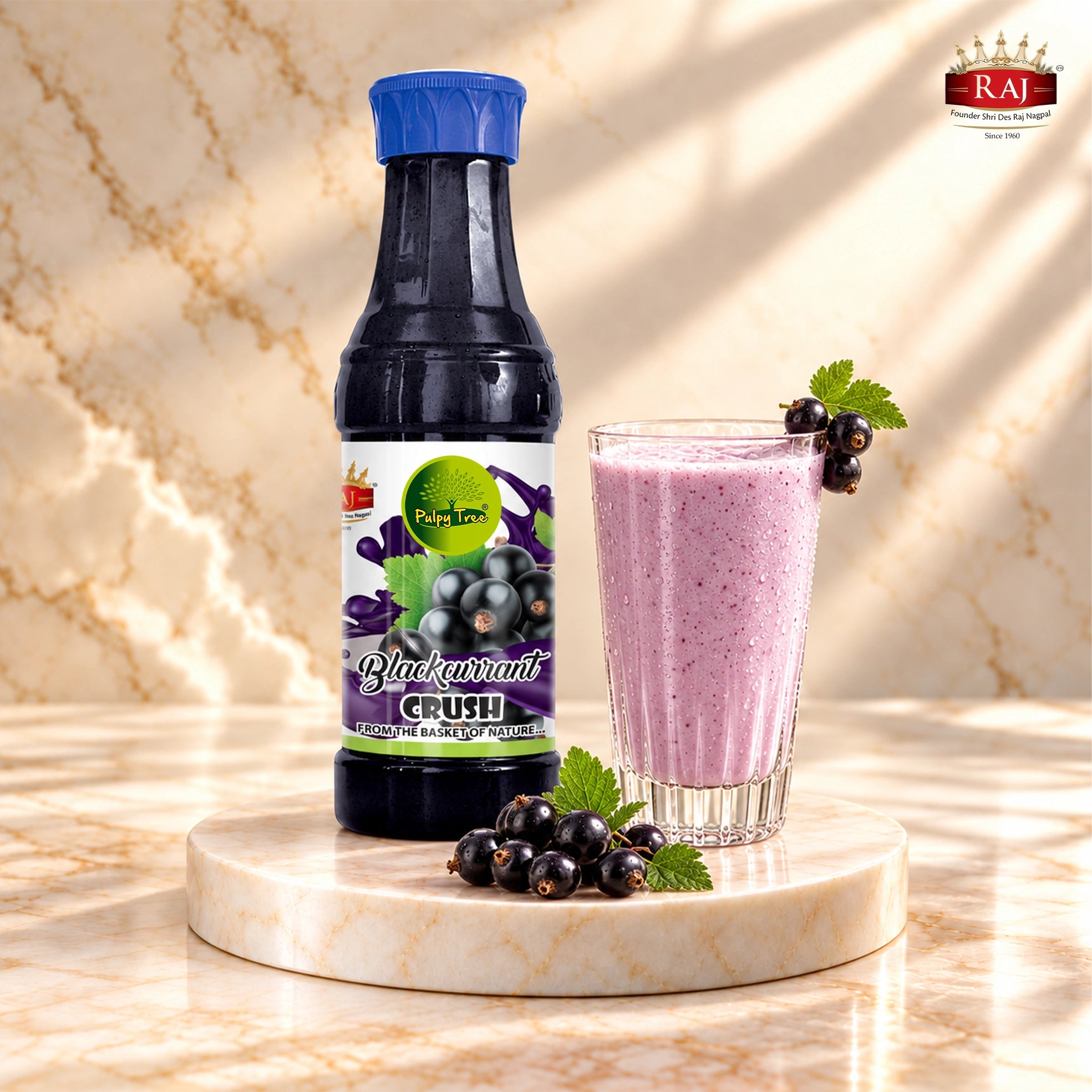 RAJ Pulpy Tree Blackcurrant Crush bottle with blackcurrant milkshake and fresh berries on a marble podium