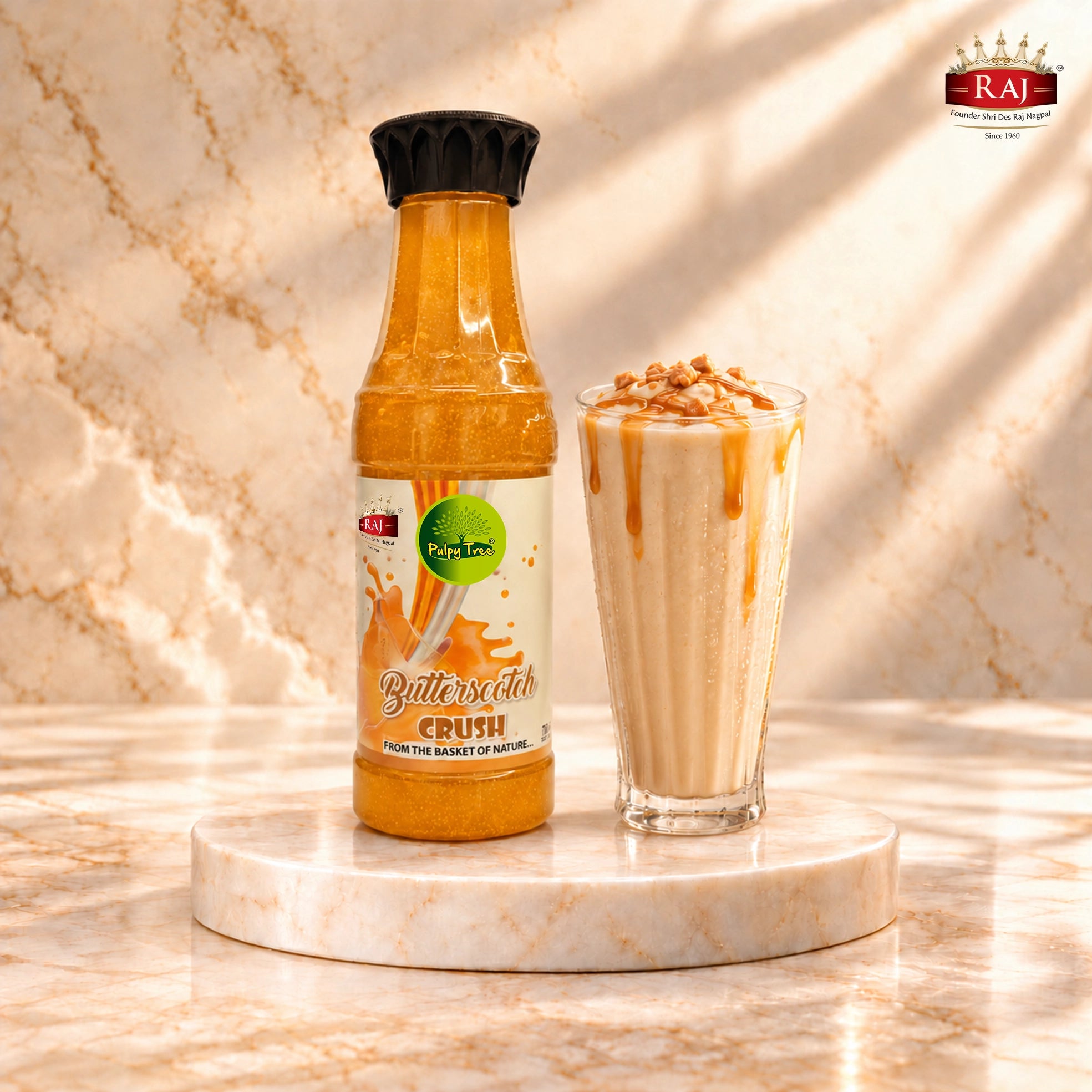 RAJ Pulpy Tree Butterscotch Crush bottle beside a creamy milkshake with butterscotch drizzle