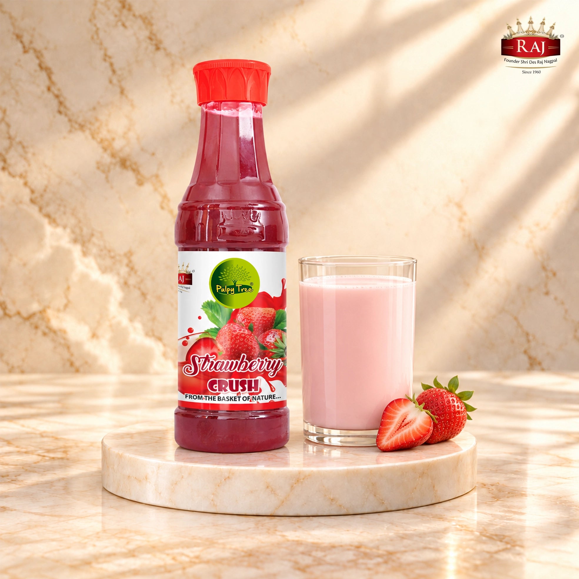 Strawberry Crush bottle beside a glass of pink strawberry milk and fresh strawberries