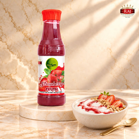 Strawberry Crush bottle beside yogurt with a strawberry swirl, sliced strawberries and granola