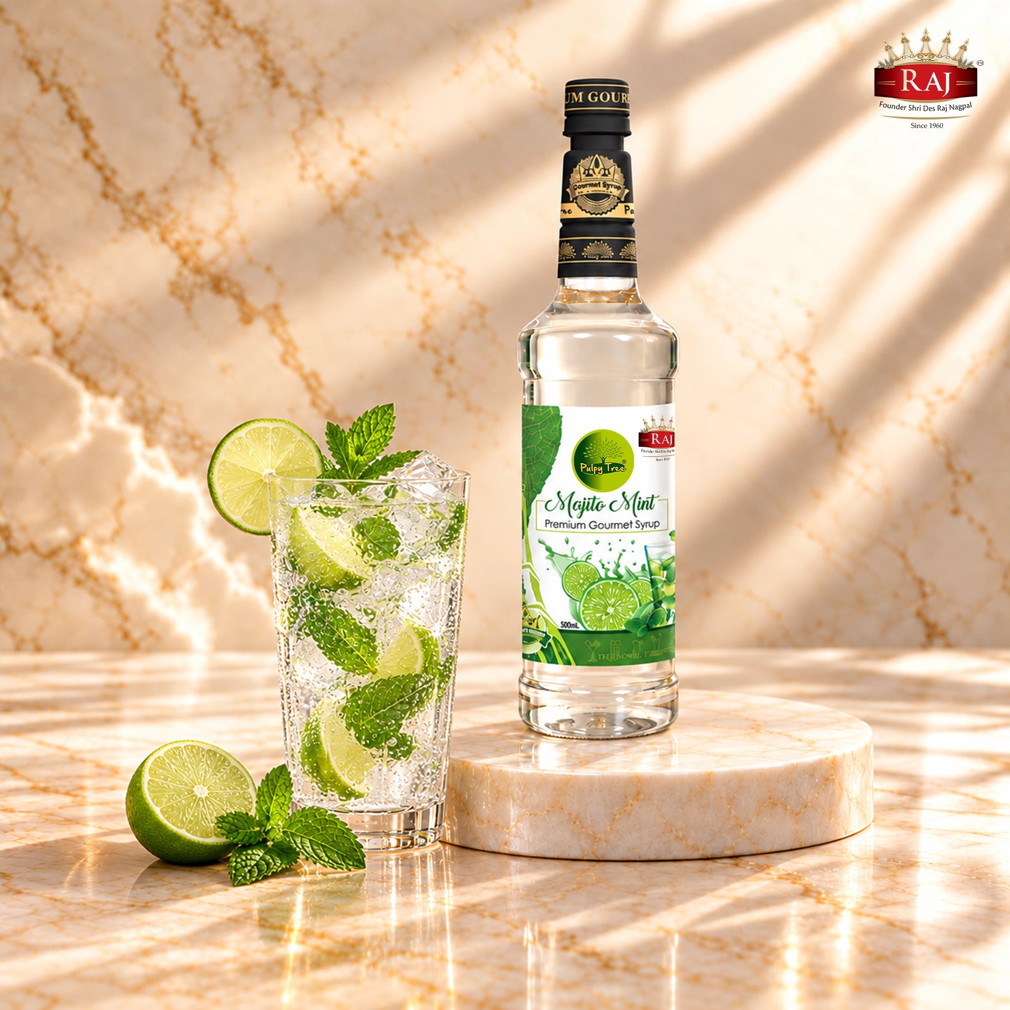 RAJ Pulpy Tree Mojito Mint syrup bottle beside a virgin mojito with fresh lime, mint and ice.