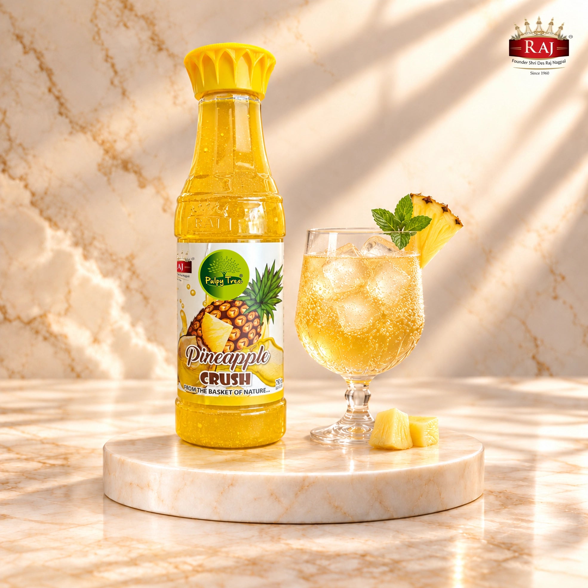 RAJ Pulpy Tree Pineapple Crush bottle with a sparkling pineapple mocktail and mint garnish