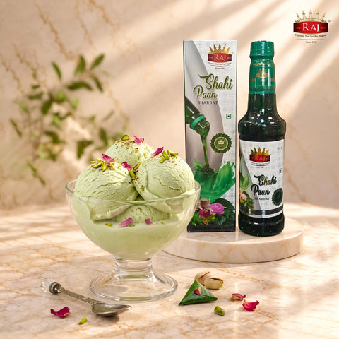 Shahi Paan Ice Cream scoops in a clear bowl with RAJ Shahi Paan Sharbat 500 ml bottle and carton